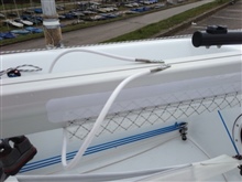 Mainsheet led along underside of boom in fabric sleeve